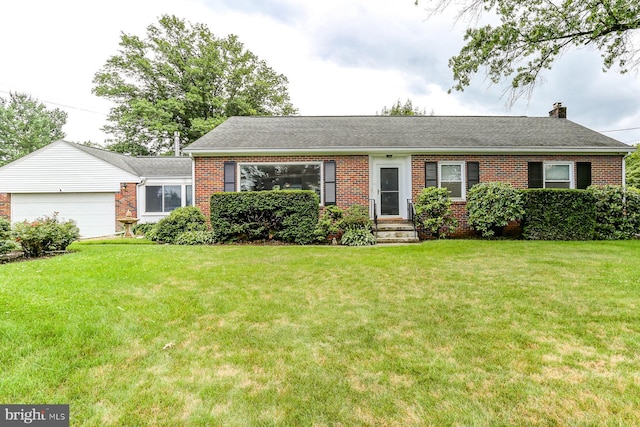 518 E Winding Hill Rd, Mechanicsburg, PA 17055 - ranch-style home with brick siding, a front yard, a garage, a chimney, and roof with shingles