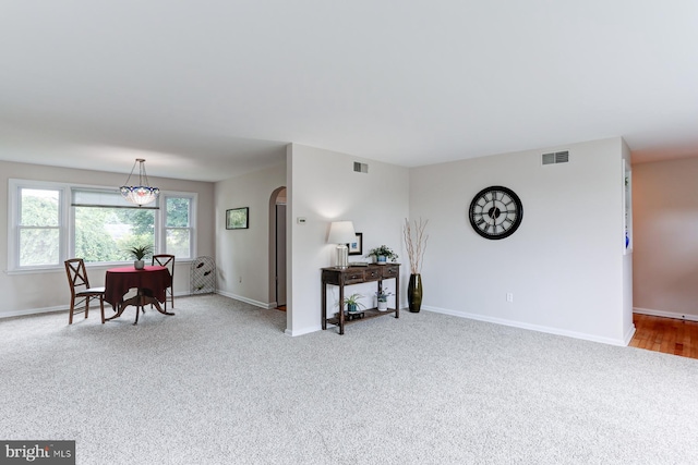 518 E Winding Hill Rd, Mechanicsburg, PA 17055 - living room featuring arched walkways and carpet