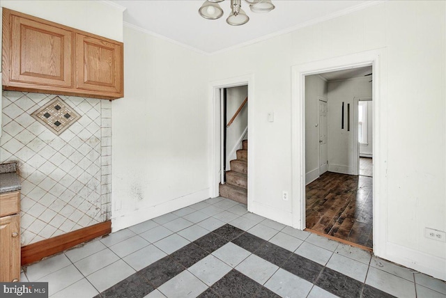 607 Salem Ave, Hagerstown, MD 21740 - unfurnished dining area featuring ornamental molding, a chandelier, stairs, and light tile patterned flooring