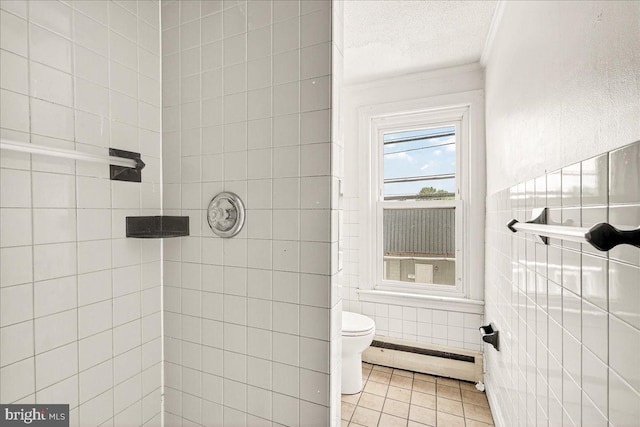 607 Salem Ave, Hagerstown, MD 21740 - full bathroom featuring a baseboard heating unit, crown molding, tile walls, a tile shower, and tile patterned floors