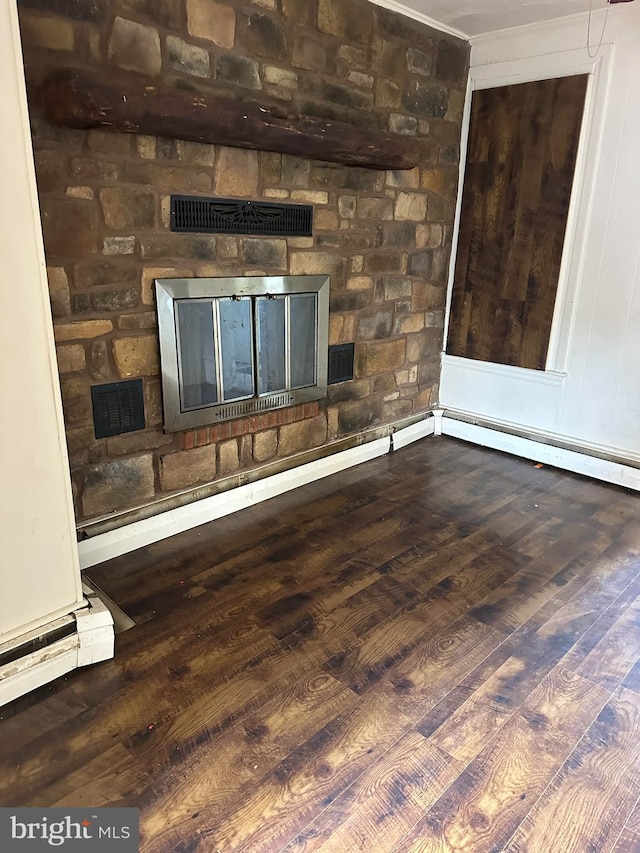 607 Salem Ave, Hagerstown, MD 21740 - detailed view of a stone fireplace, wood finished floors, and baseboard heating