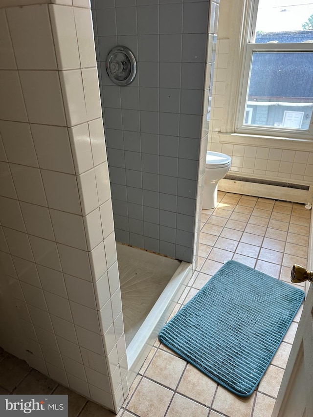 607 Salem Ave, Hagerstown, MD 21740 - full bath with a baseboard radiator, a stall shower, tile patterned flooring, and tile walls