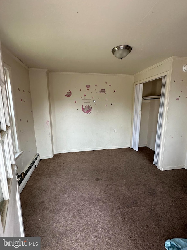 607 Salem Ave, Hagerstown, MD 21740 - unfurnished bedroom featuring dark colored carpet, a closet, and a baseboard heating unit