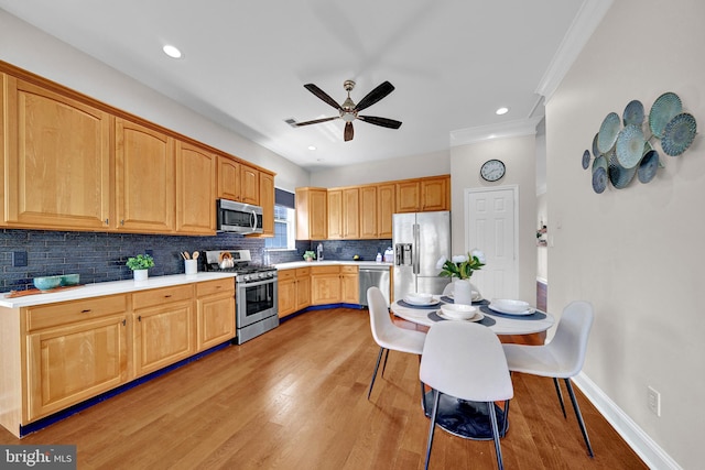 32 Brewster Ct, Pennington, NJ 08534 - kitchen featuring stainless steel appliances, ceiling fan, tasteful backsplash, light wood-type flooring, and light countertops