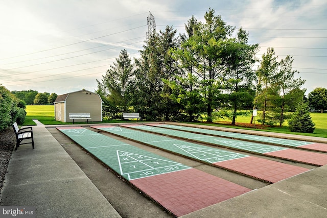 32 Brewster Ct, Pennington, NJ 08534 - view of community with a yard, a shed, and shuffleboard