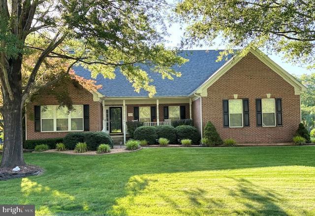 61 Kirby Ln, Stafford, VA 22554 - single story home with a front lawn, brick siding, and covered porch