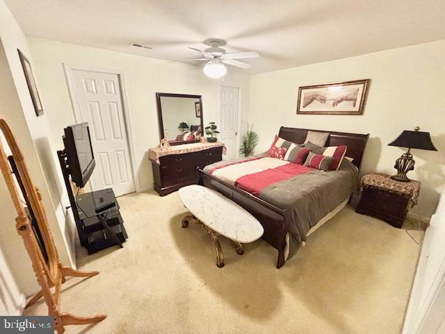 61 Kirby Ln, Stafford, VA 22554 - bedroom with light colored carpet and ceiling fan