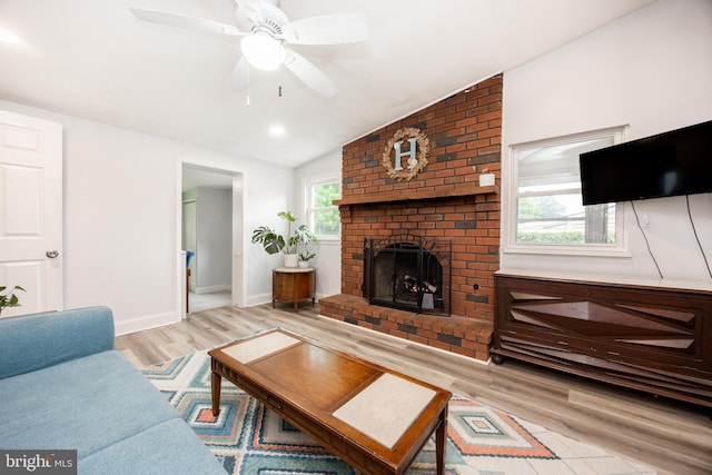 661 Schoolside Ln, Swarthmore, PA 19081 - living room with light wood-style flooring, vaulted ceiling, a brick fireplace, and ceiling fan