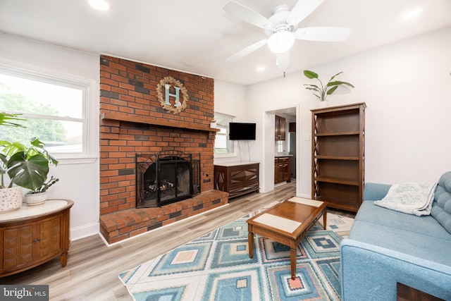 661 Schoolside Ln, Swarthmore, PA 19081 - living area featuring wood finished floors, a brick fireplace, a ceiling fan, and recessed lighting