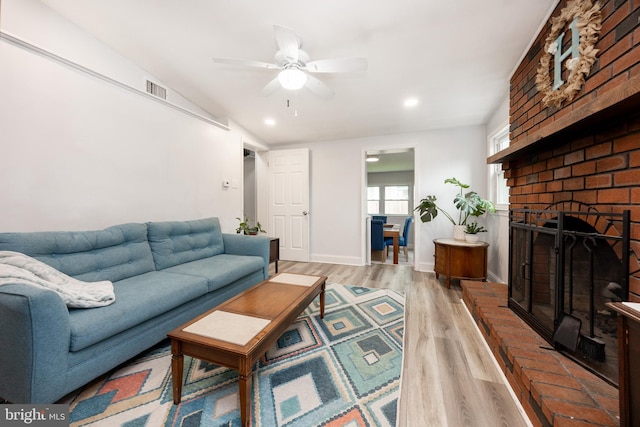 661 Schoolside Ln, Swarthmore, PA 19081 - living room with light wood-style floors, a brick fireplace, ceiling fan, and recessed lighting