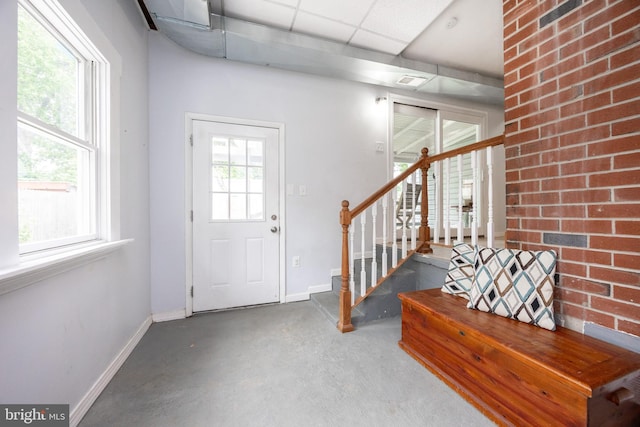 661 Schoolside Ln, Swarthmore, PA 19081 - entryway with concrete flooring, stairway, and a paneled ceiling