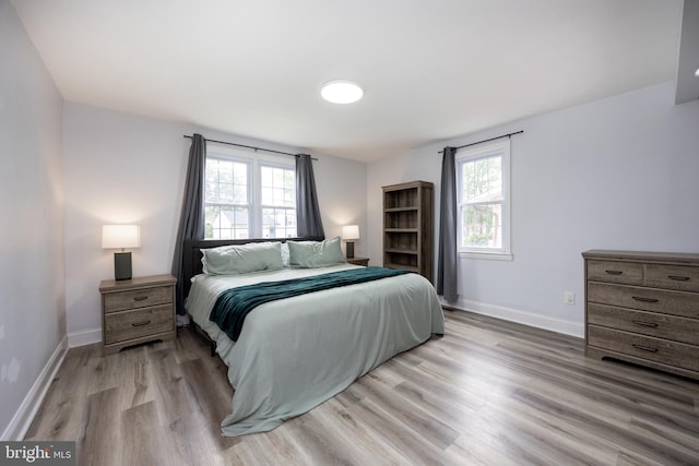 661 Schoolside Ln, Swarthmore, PA 19081 - bedroom featuring light wood-type flooring and multiple windows