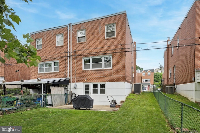 7512 Valley Ave, Philadelphia, PA 19128 - rear view of house featuring a fenced backyard and brick siding