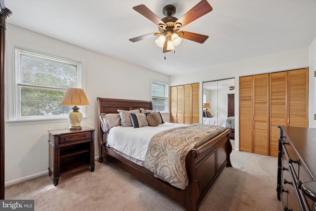 7512 Valley Ave, Philadelphia, PA 19128 - bedroom with light colored carpet, two closets, and a ceiling fan
