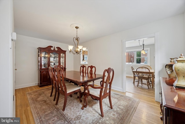 7512 Valley Ave, Philadelphia, PA 19128 - dining area featuring a chandelier and light wood-style floors