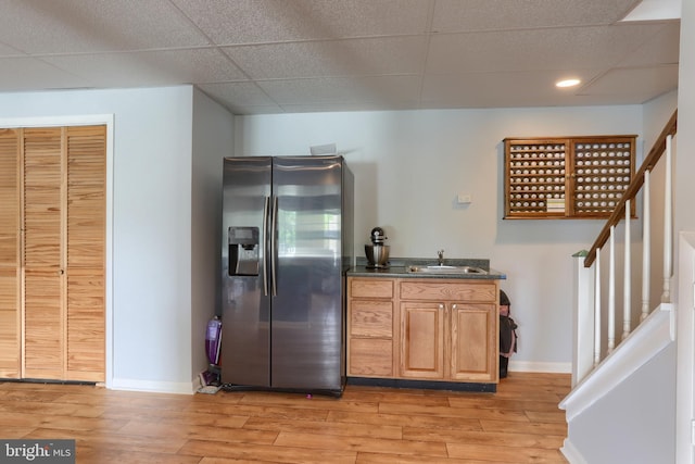 909 S 3rd St, Lebanon, PA 17042 - kitchen featuring stainless steel fridge with ice dispenser, light wood-style flooring, dark countertops, recessed lighting, and a drop ceiling