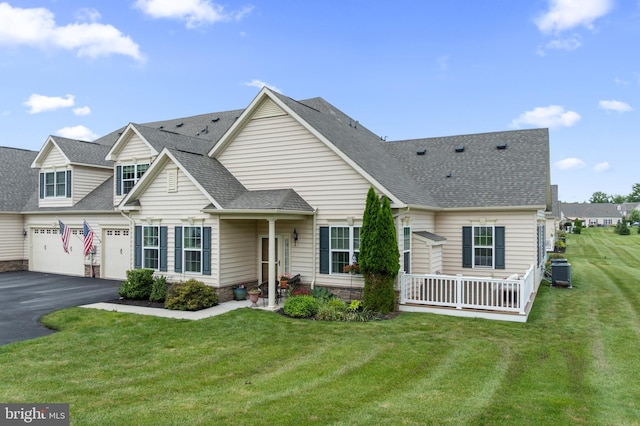 1080 Arbour Ln, Quakertown, PA 18951 - view of front of home with an attached garage, asphalt driveway, a shingled roof, and a front lawn