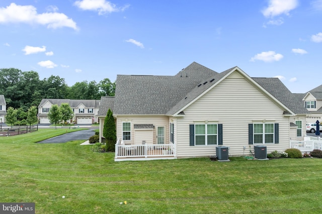 1080 Arbour Ln, Quakertown, PA 18951 - back of house featuring a lawn and roof with shingles