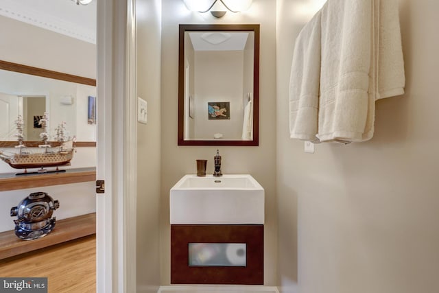 8162 Madrillon Ct, Vienna, VA 22182 - bathroom featuring a sink and wood finished floors