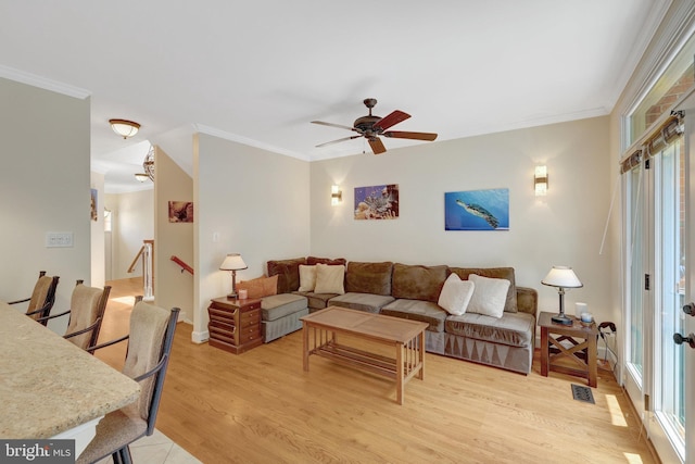 8162 Madrillon Ct, Vienna, VA 22182 - living room with a ceiling fan, light wood-type flooring, crown molding, and healthy amount of natural light
