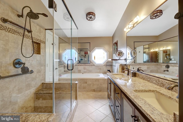 8162 Madrillon Ct, Vienna, VA 22182 - bathroom with tile patterned floors, a garden tub, double vanity, and a shower stall