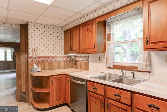 175 Dellville Rd, Duncannon, PA 17020 - kitchen with dishwasher, wallpapered walls, light countertops, plenty of natural light, and brown cabinets