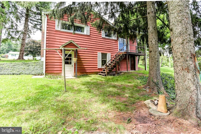 175 Dellville Rd, Duncannon, PA 17020 - view of front facade with stairs, a deck, and a front lawn