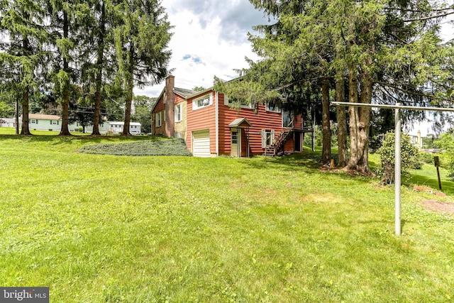 175 Dellville Rd, Duncannon, PA 17020 - view of grassy yard with an attached garage and stairway