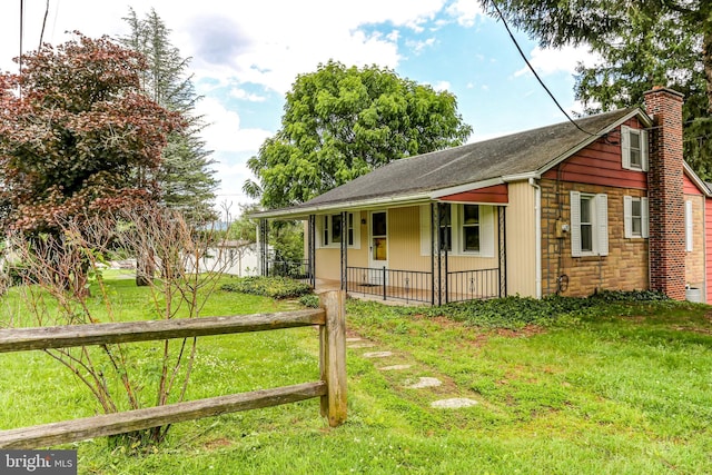 175 Dellville Rd, Duncannon, PA 17020 - view of front of home featuring covered porch, a chimney, and roof with shingles