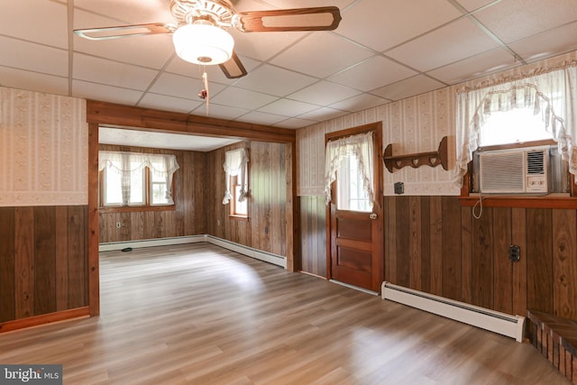 175 Dellville Rd, Duncannon, PA 17020 - entryway featuring a baseboard heating unit, wallpapered walls, a paneled ceiling, wood finished floors, and wainscoting