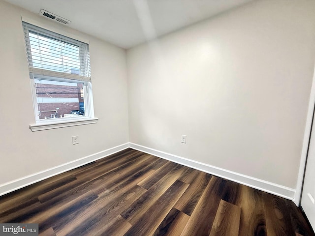 123 E Cross St, Baltimore, MD 21230 - unfurnished room featuring baseboards and dark wood-style floors