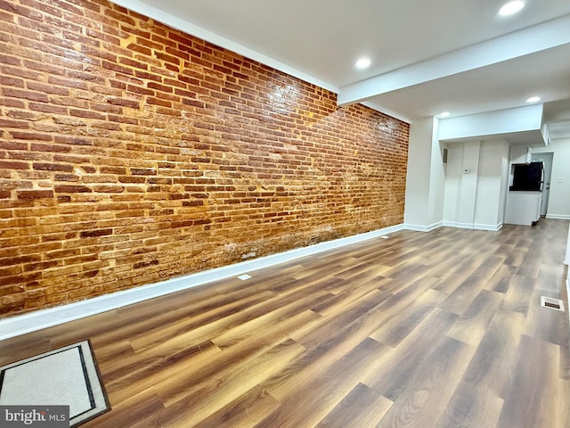 123 E Cross St, Baltimore, MD 21230 - finished basement featuring wood finished floors, brick wall, and recessed lighting