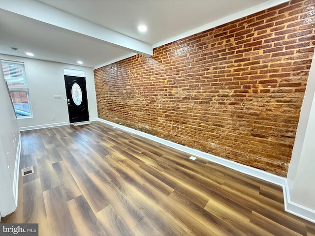 123 E Cross St, Baltimore, MD 21230 - foyer with wood finished floors, brick wall, beam ceiling, and recessed lighting