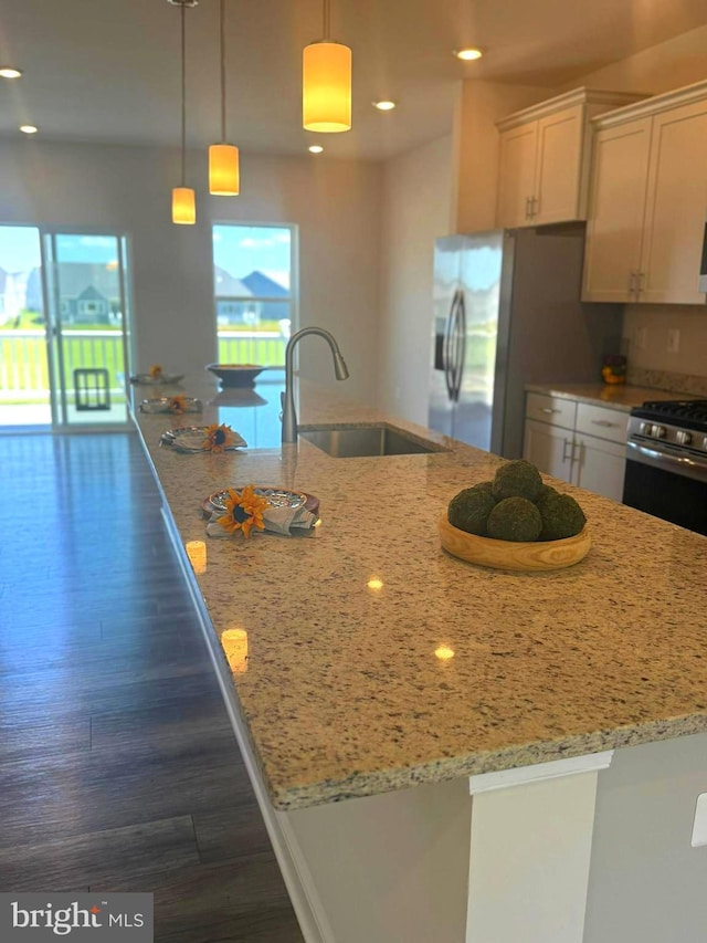 35146 Wright Way, Millsboro, DE 19966 - kitchen with appliances with stainless steel finishes, white cabinetry, light stone counters, a spacious island, and dark wood-type flooring