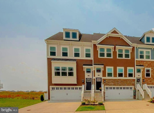 35354 Wright Way, Millsboro, DE 19966 - view of front of home featuring an attached garage, driveway, and stone siding