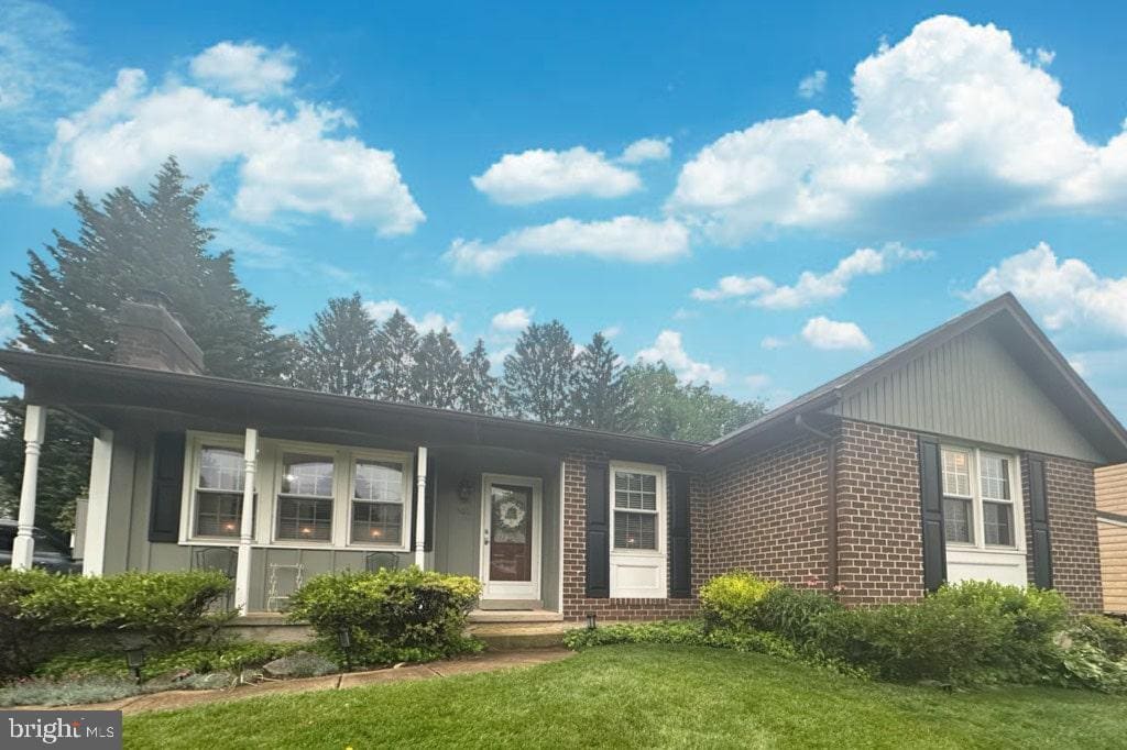 502 Red Pump Rd, Bel Air, MD 21014 - single story home with brick siding, a front yard, and a chimney