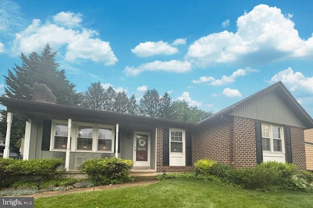 502 Red Pump Rd, Bel Air, MD 21014 - single story home with brick siding, a front yard, and a chimney