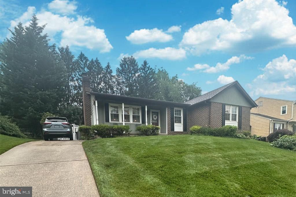 502 Red Pump Rd, Bel Air, MD 21014 - view of front of home featuring a front yard, a chimney, driveway, and brick siding
