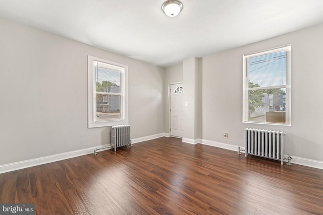 223 Hudson St, Gloucester City, NJ 08030 - unfurnished room featuring radiator and wood finished floors