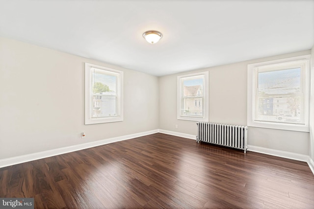 223 Hudson St, Gloucester City, NJ 08030 - unfurnished room with radiator heating unit and wood finished floors