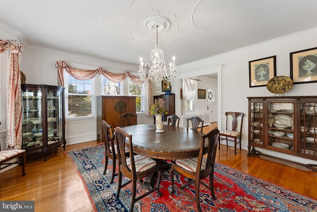 4600 Atlantic Ave, Atlantic City, NJ 08401 - dining space with a chandelier, light wood-style flooring, and crown molding