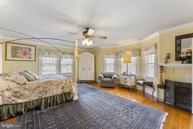 4600 Atlantic Ave, Atlantic City, NJ 08401 - bedroom with multiple windows, wood finished floors, crown molding, a fireplace, and ceiling fan