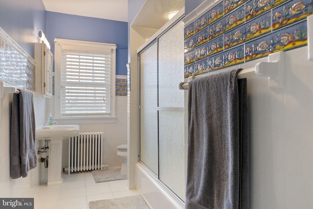 4600 Atlantic Ave, Atlantic City, NJ 08401 - bathroom with radiator heating unit, tile patterned flooring, tile walls, and enclosed tub / shower combo
