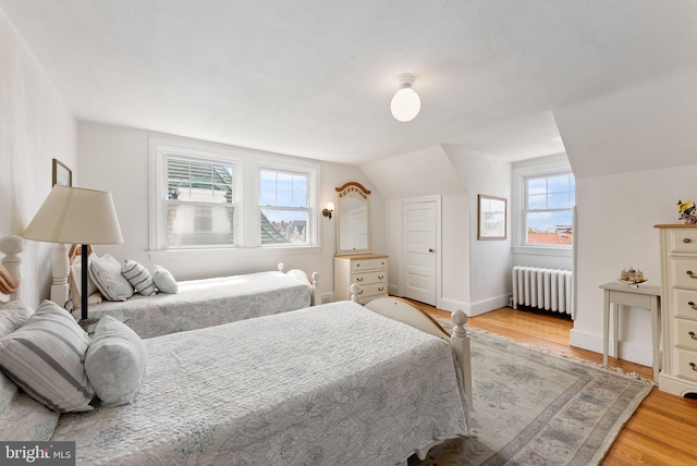 4600 Atlantic Ave, Atlantic City, NJ 08401 - bedroom with radiator, light wood-style floors, and vaulted ceiling
