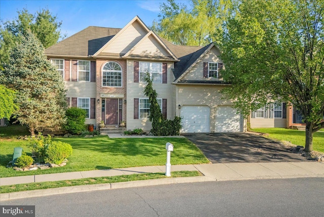 420 Highlands Blvd, Easton, PA 18042 - colonial house with driveway, an attached garage, and a front lawn