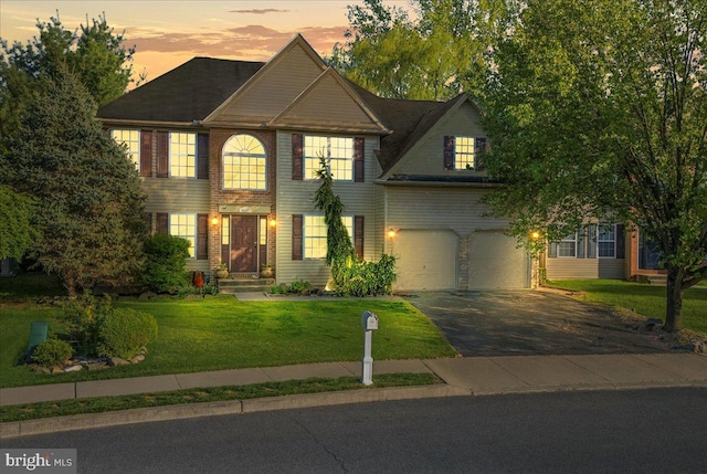 420 Highlands Blvd, Easton, PA 18042 - colonial home featuring asphalt driveway, a garage, and a front yard