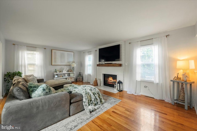 420 Highlands Blvd, Easton, PA 18042 - living room featuring a large fireplace, plenty of natural light, and wood finished floors