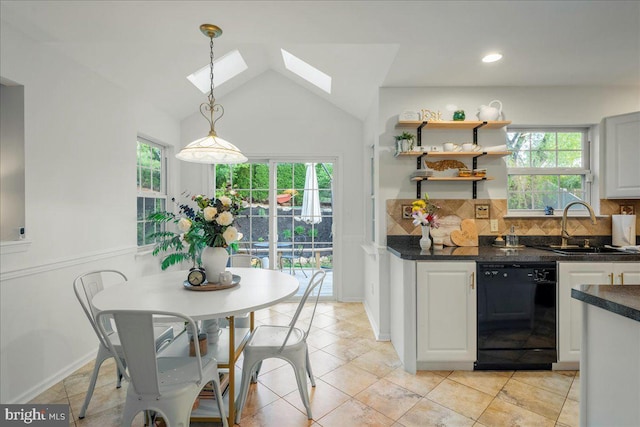 420 Highlands Blvd, Easton, PA 18042 - kitchen with dishwasher, decorative backsplash, a skylight, lofted ceiling, and hanging light fixtures