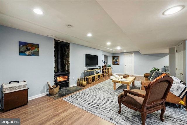 420 Highlands Blvd, Easton, PA 18042 - living area with wood finished floors, recessed lighting, and a wood stove