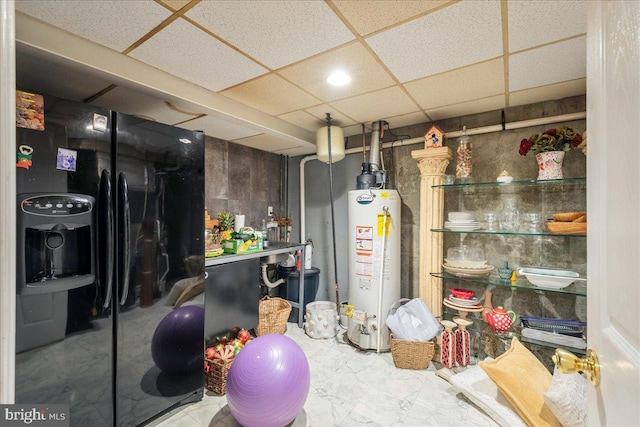 420 Highlands Blvd, Easton, PA 18042 - finished below grade area with gas water heater, a paneled ceiling, and marble finish flooring